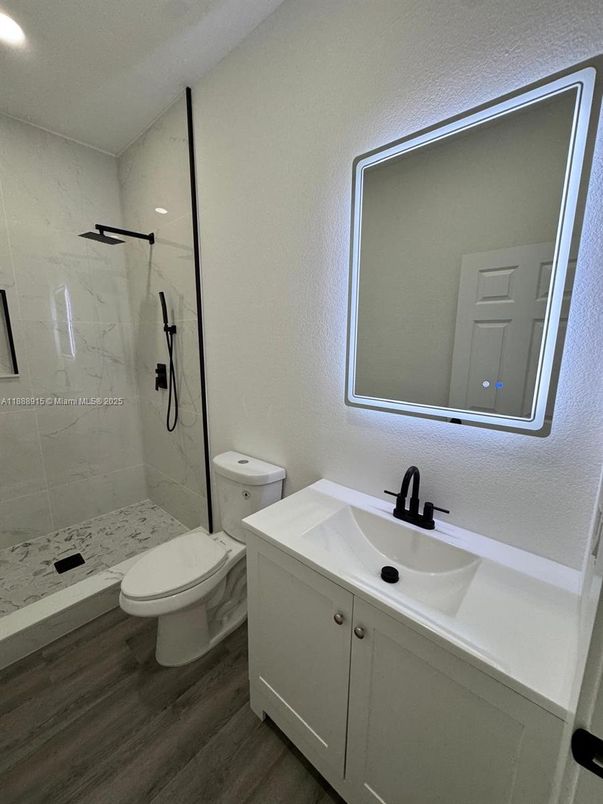Bathroom, Glass Shower, Interior, Marble Walls, Recessed Lighting, Wood Texture Flooring