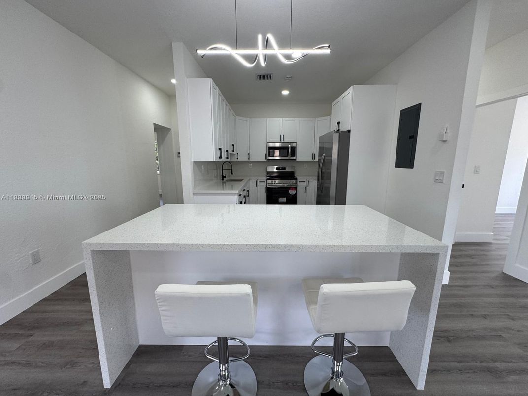 Interior, Kitchen, Pendant Lights, Recessed Lighting, Stainless Steel Appliances, Wood Texture Flooring