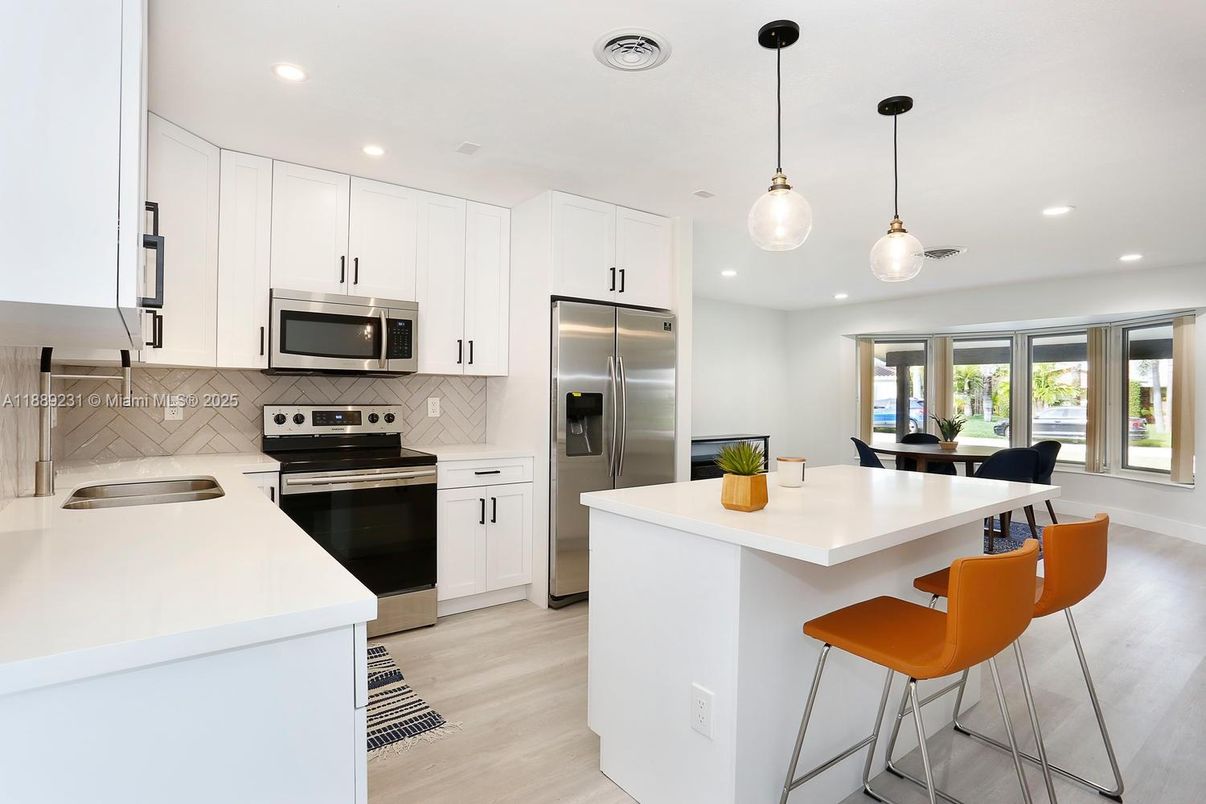 Dining room, Interior, Kitchen, Pendant Lights, Recessed Lighting, Stainless Steel Appliances, Wood Texture Flooring
