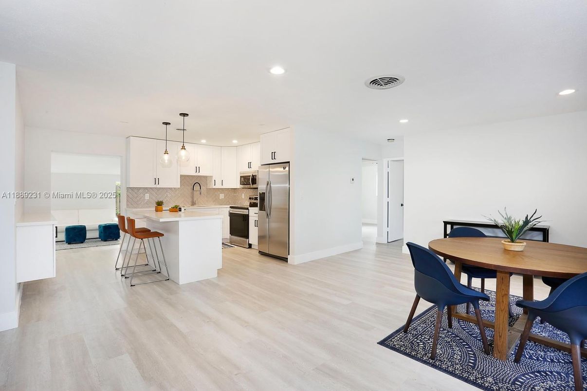 Dining room, Interior, Kitchen, Pendant Lights, Recessed Lighting, Stainless Steel Appliances, Wood Texture Flooring