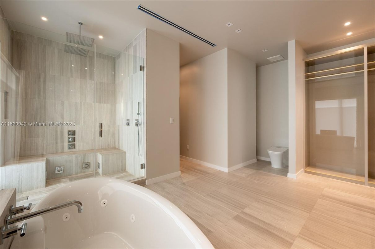 Bathroom, Glass Shower, Interior, Recessed Lighting, Walk-in Closets, Wood Texture Flooring