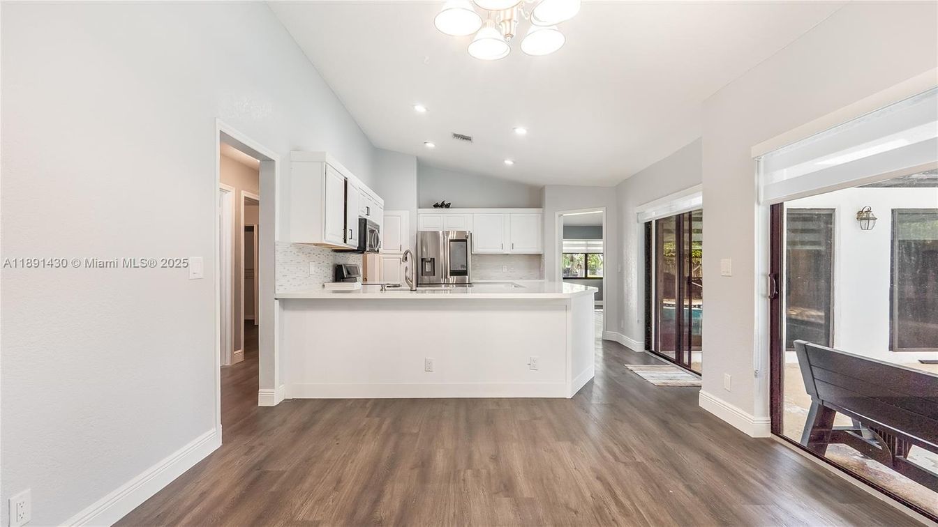 Dining room, Interior, Kitchen, Recessed Lighting, Stainless Steel Appliances, Wood Texture Flooring