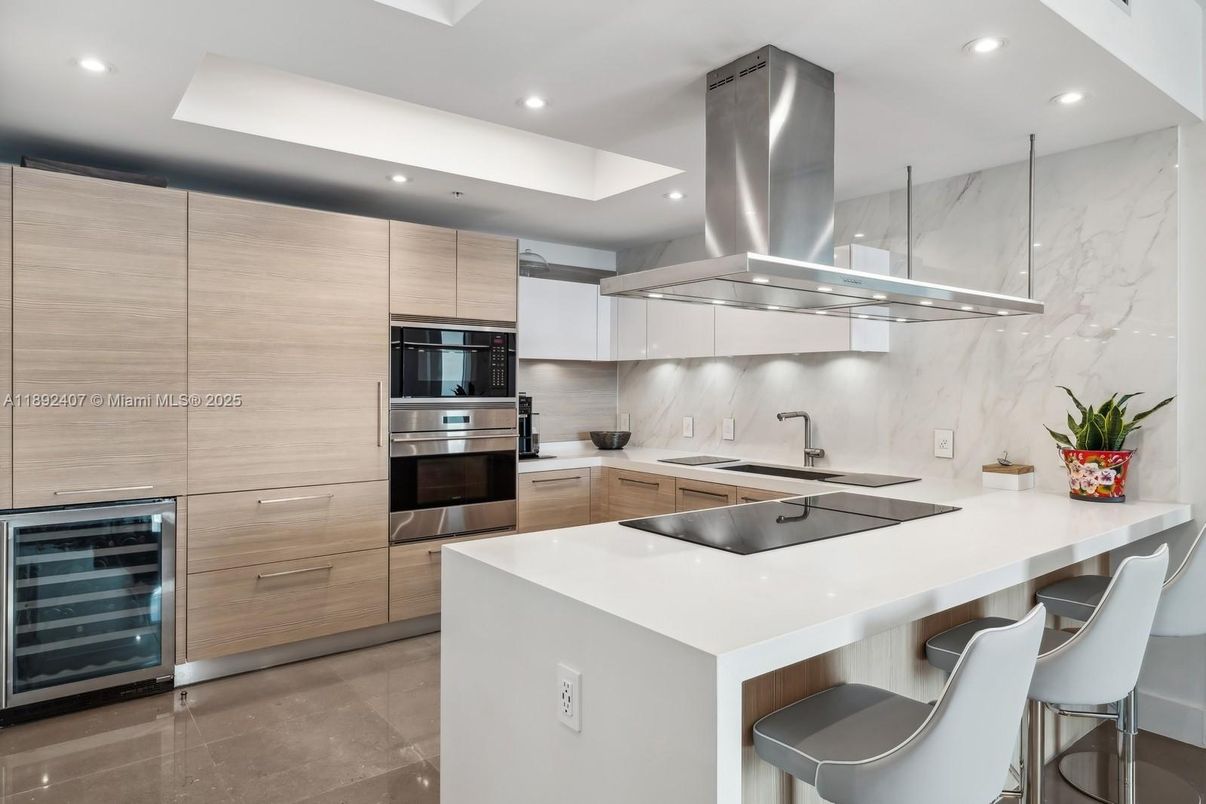 Interior, Kitchen, Marble Walls, Recessed Lighting, Stainless Steel Appliances