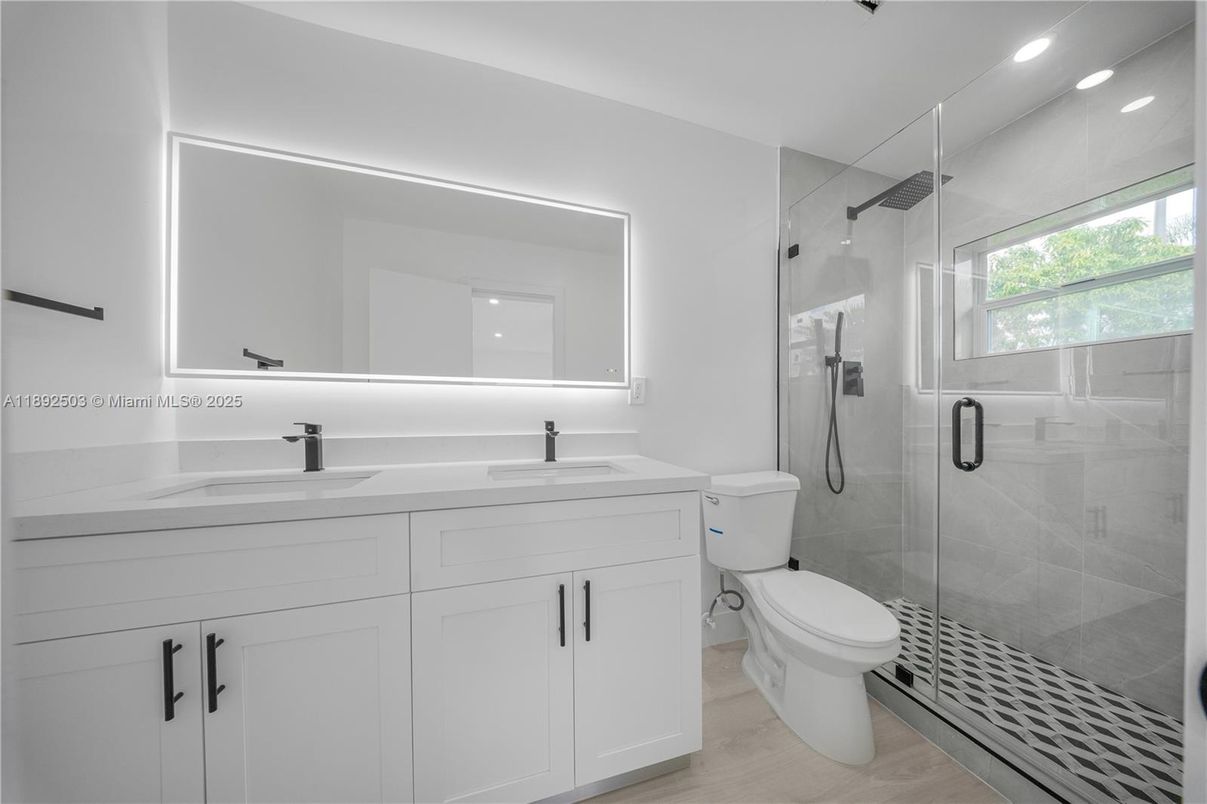 Bathroom, Dual Sink Vanities, Glass Shower, Interior, Recessed Lighting, Wood Texture Flooring