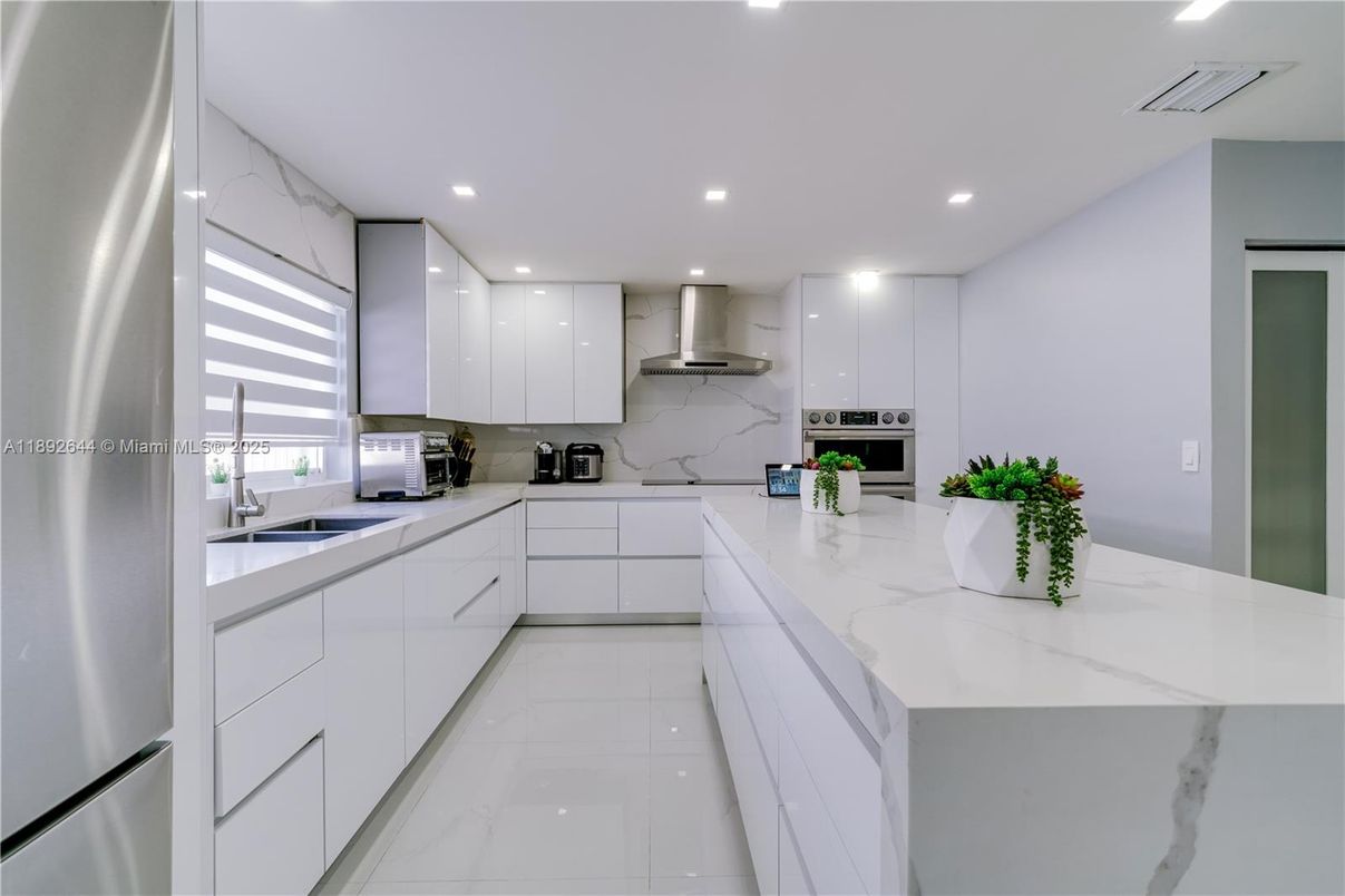 Interior, Kitchen, Marble, Marble Walls, Recessed Lighting, Stainless Steel Appliances