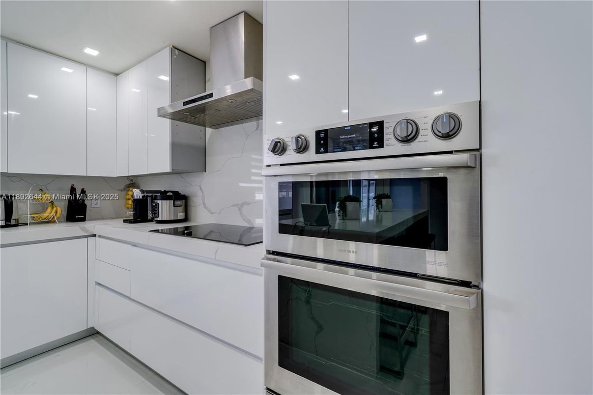 Interior, Kitchen, Marble Walls, Recessed Lighting, Stainless Steel Appliances