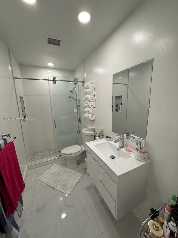 Bathroom, Dual Sink Vanities, Glass Shower, Interior, Marble, Recessed Lighting