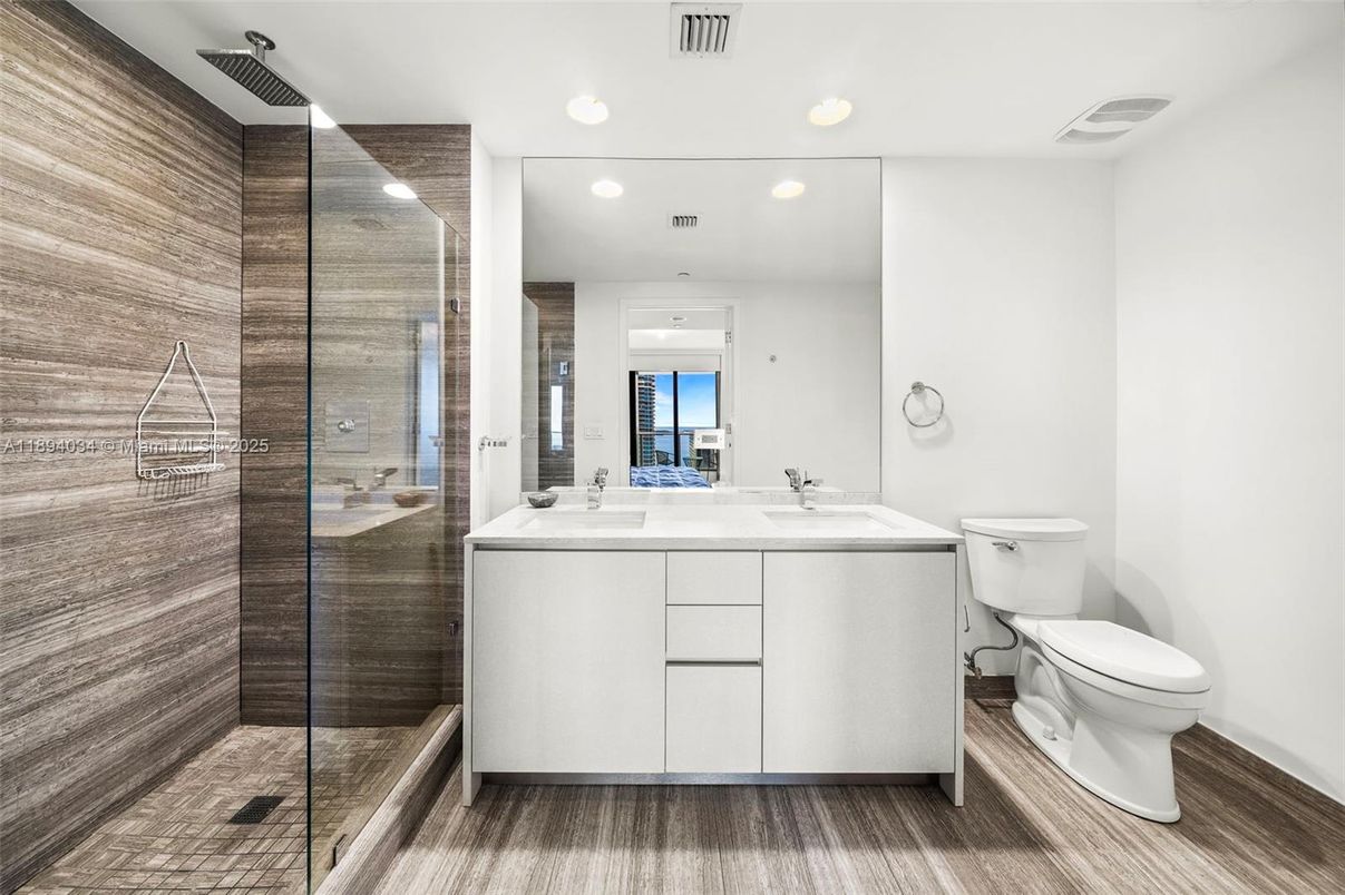 Bathroom, Dual Sink Vanities, Glass Shower, Interior, Recessed Lighting, Wood Texture Flooring