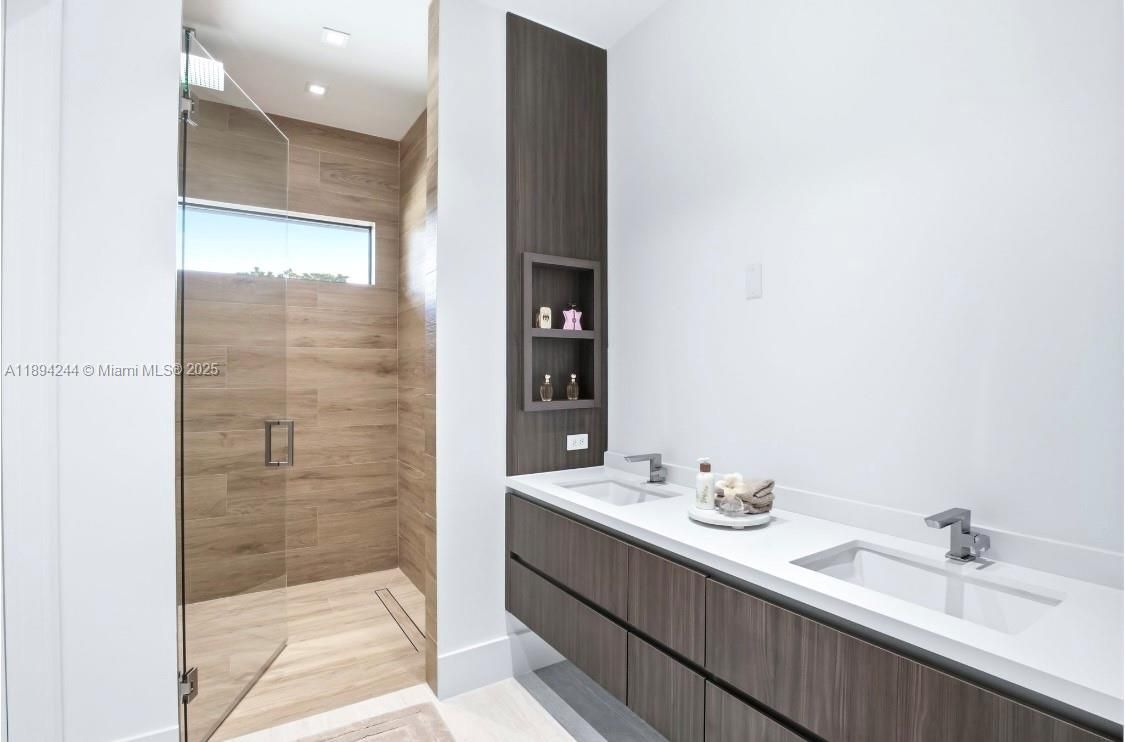 Bathroom, Dual Sink Vanities, Glass Shower, Interior, Recessed Lighting, Wood Texture Flooring