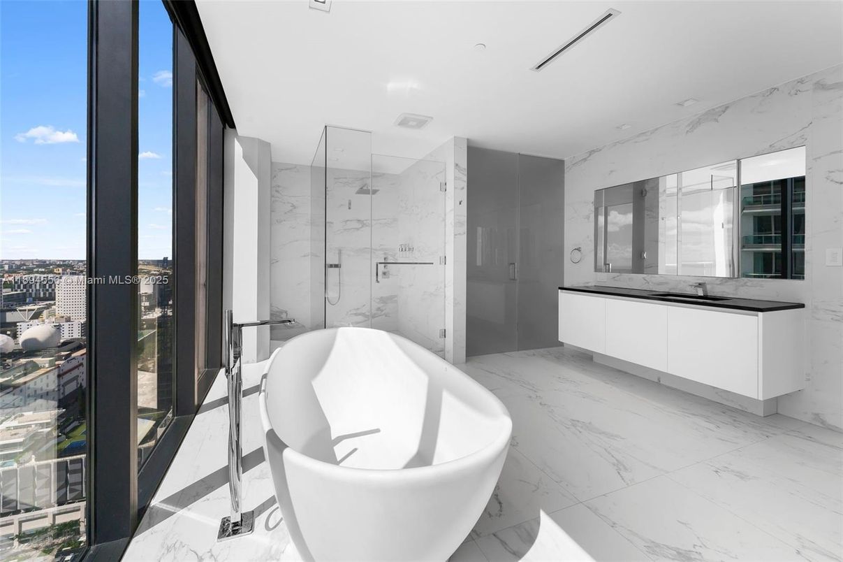 Bathroom, Free Standing Baths, Glass Shower, Interior, Marble, Marble Walls, Recessed Lighting