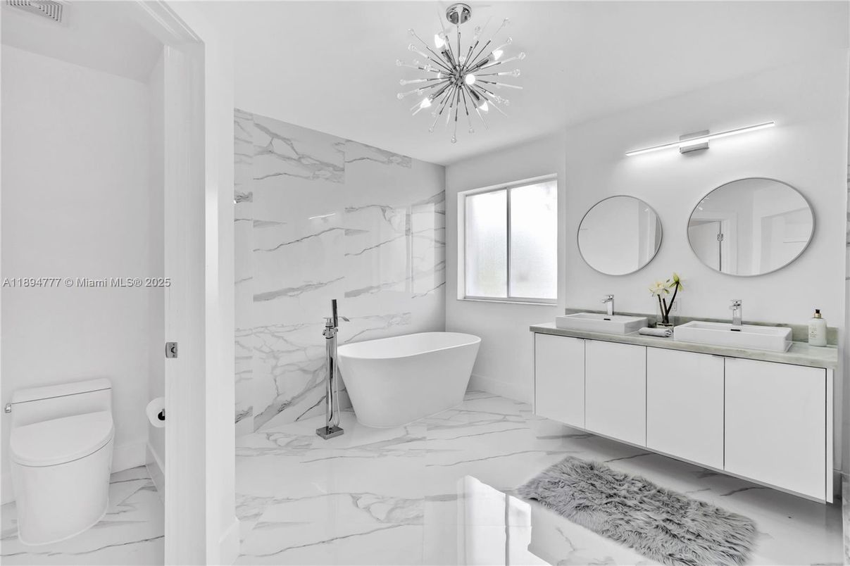 Bathroom, Dual Sink Vanities, Free Standing Baths, Interior, Marble, Marble Walls, Pendant Lights