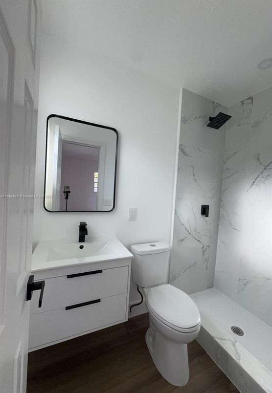 Bathroom, Dual Sink Vanities, Interior, Marble Walls, Wood Texture Flooring