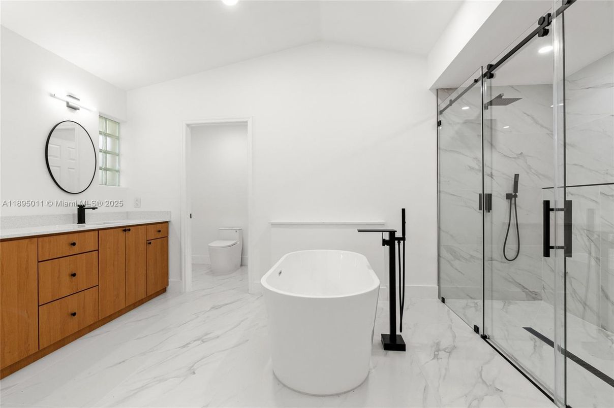 Bathroom, Dual Sink Vanities, Free Standing Baths, Glass Shower, Interior, Marble, Marble Walls, Recessed Lighting