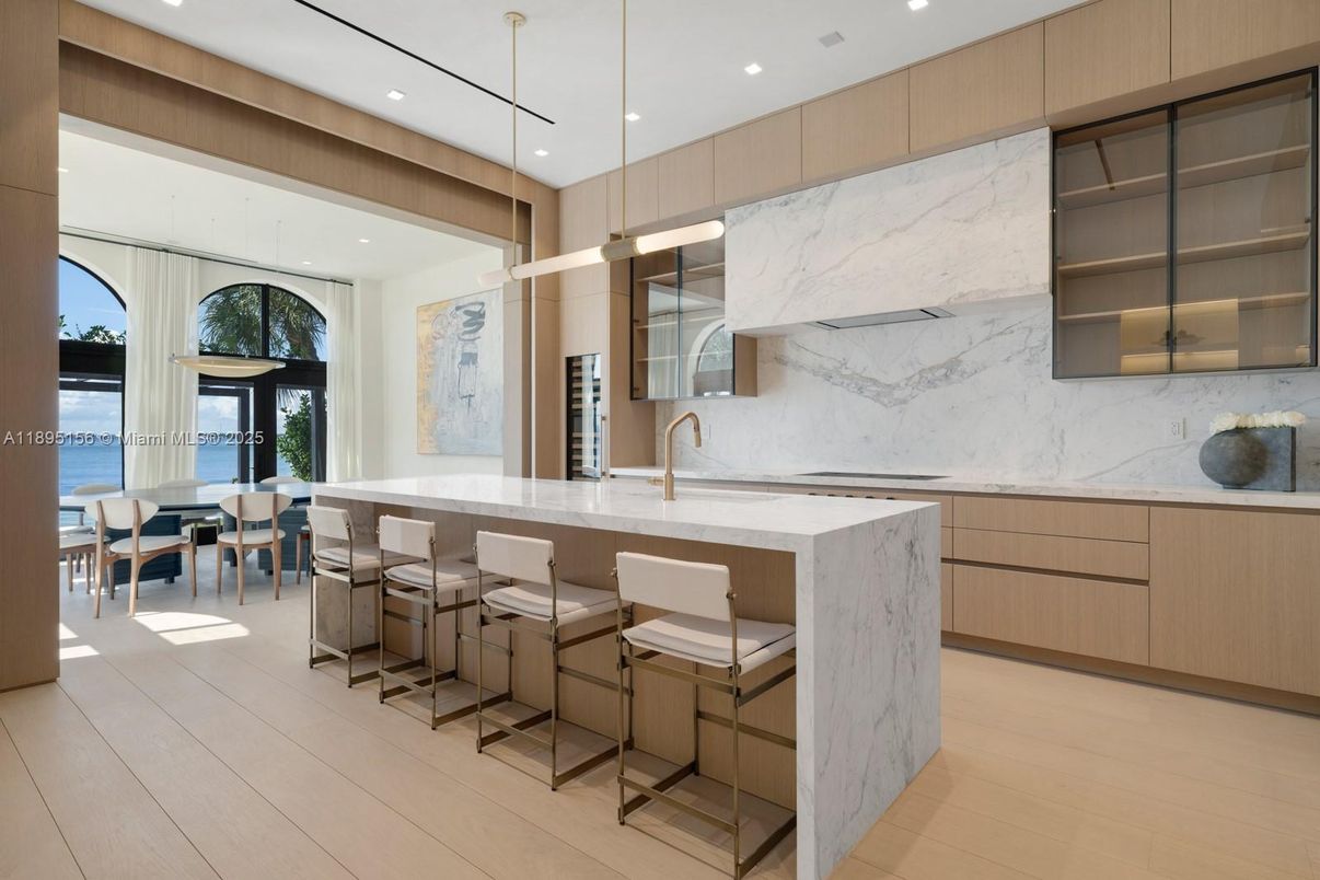 Dining room, Interior, Kitchen, Marble Walls, Pendant Lights, Recessed Lighting, Water, Wood Texture Flooring