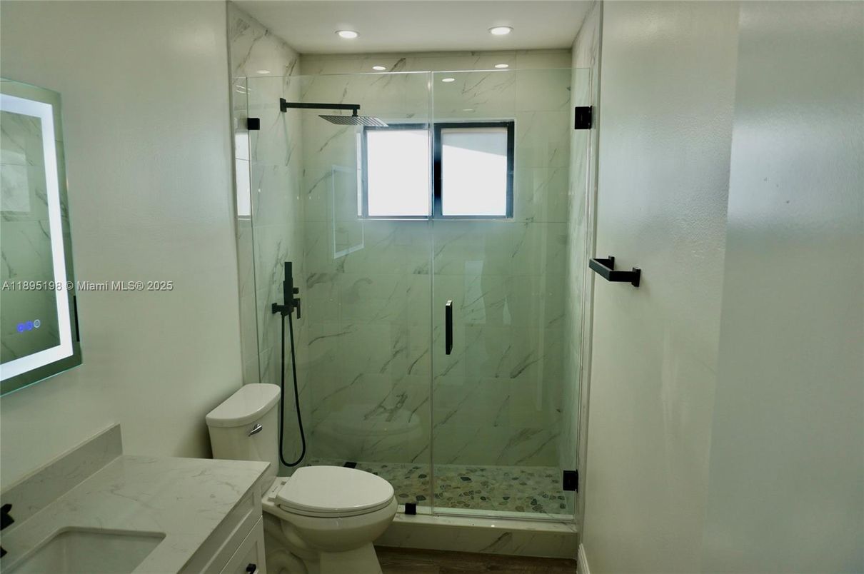 Bathroom, Glass Shower, Interior, Marble Walls, Recessed Lighting, Wood Texture Flooring