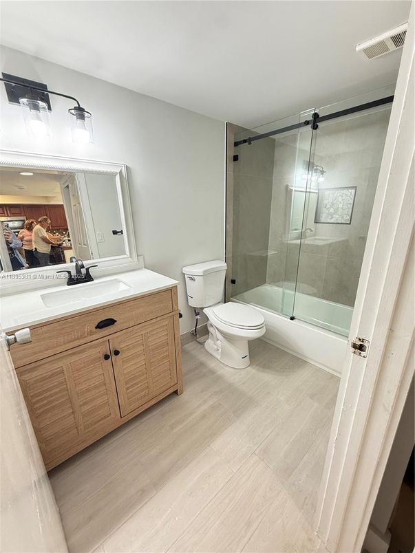 Bathroom, Dual Sink Vanities, Glass Shower, Interior, Wood Texture Flooring