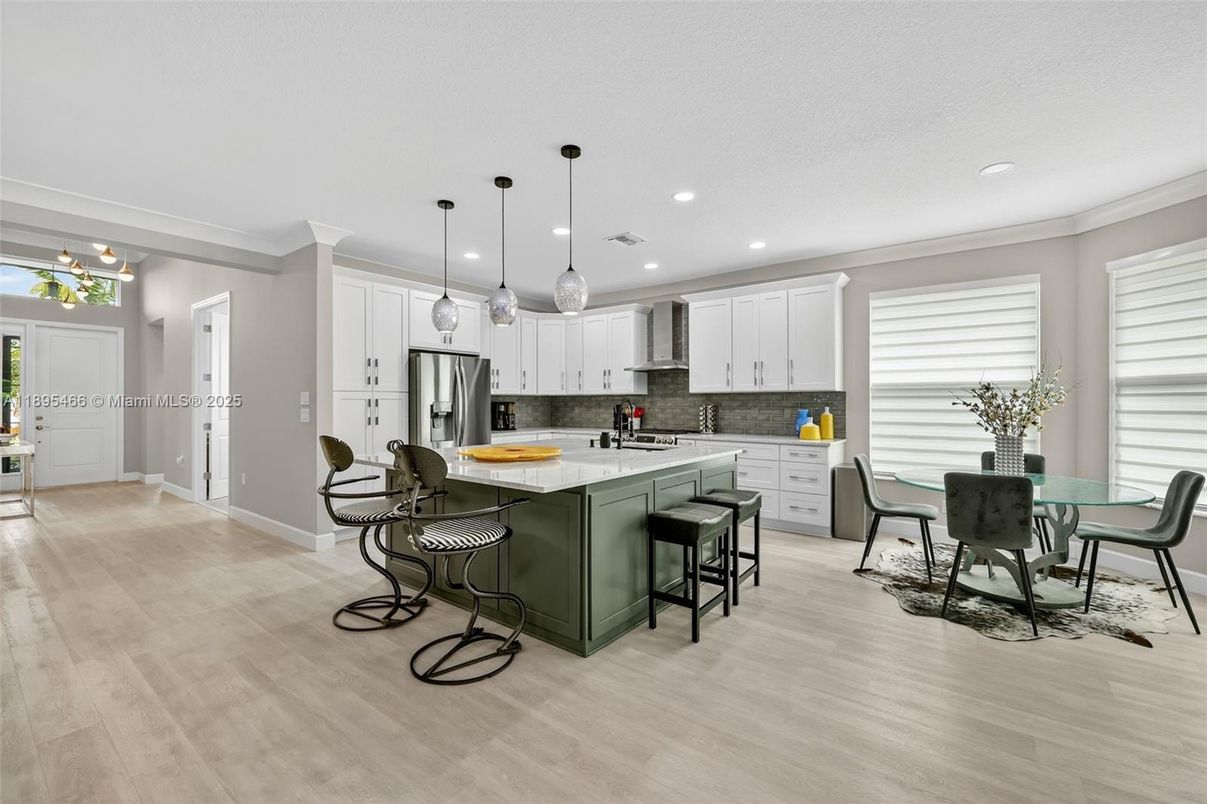 Dining room, Interior, Kitchen, Pendant Lights, Recessed Lighting, Stainless Steel Appliances, Wood Texture Flooring