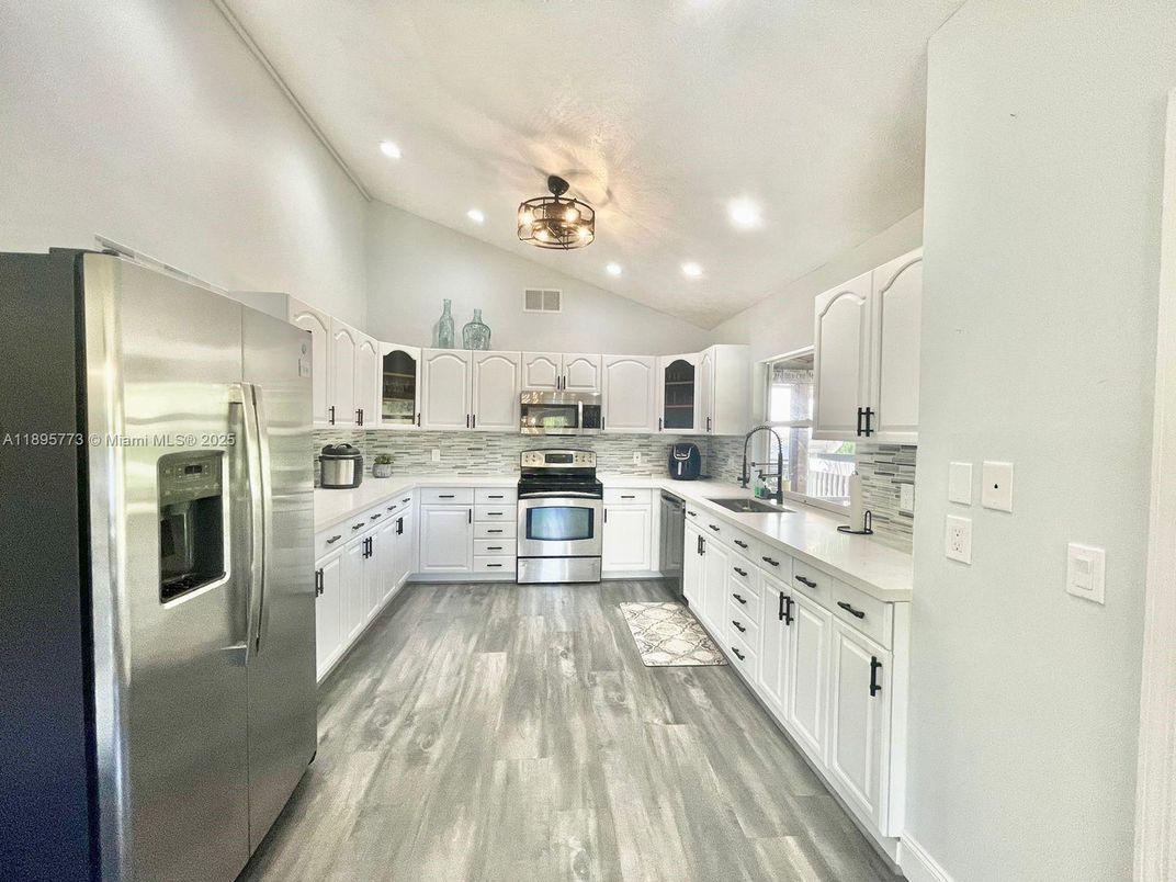 Interior, Kitchen, Recessed Lighting, Stainless Steel Appliances, Wood Texture Flooring