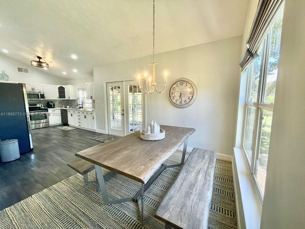 Chandelier, Dining room, Interior, Kitchen, Recessed Lighting, Stainless Steel Appliances, Wood Texture Flooring