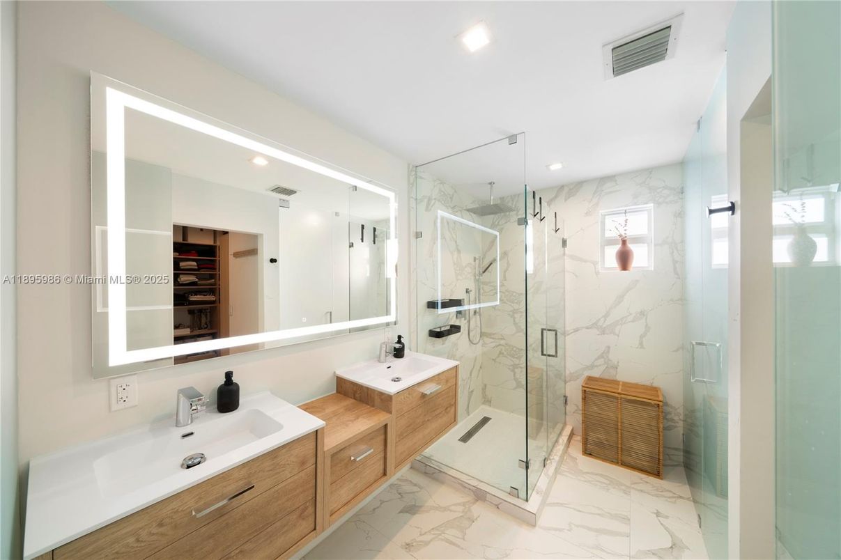 Bathroom, Dual Sink Vanities, Glass Shower, Interior, Marble, Marble Walls, Recessed Lighting