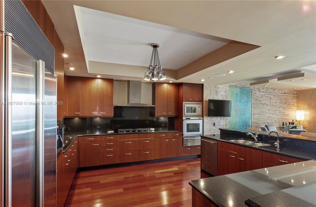 Interior, Kitchen, Pendant Lights, Recessed Lighting, Stainless Steel Appliances, Stone Walls, Wood Texture Flooring