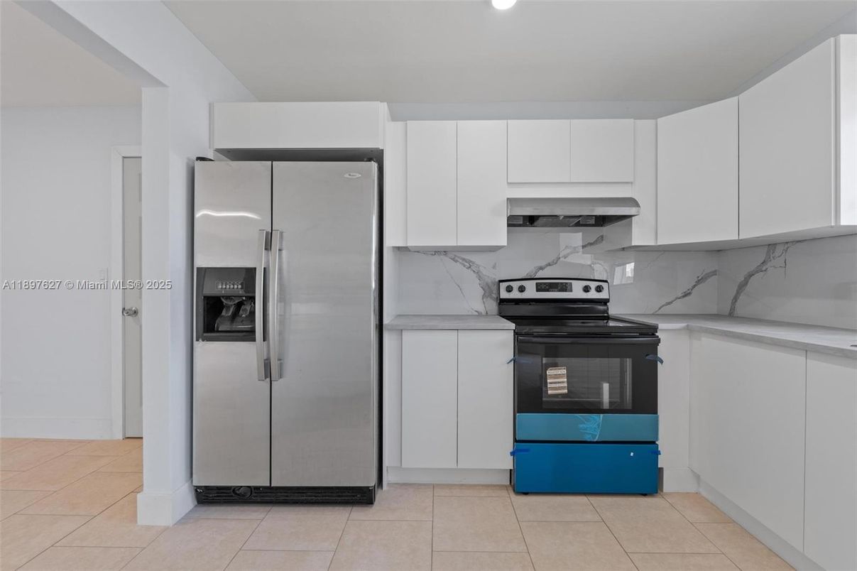 Interior, Kitchen, Marble Walls, Recessed Lighting, Stainless Steel Appliances