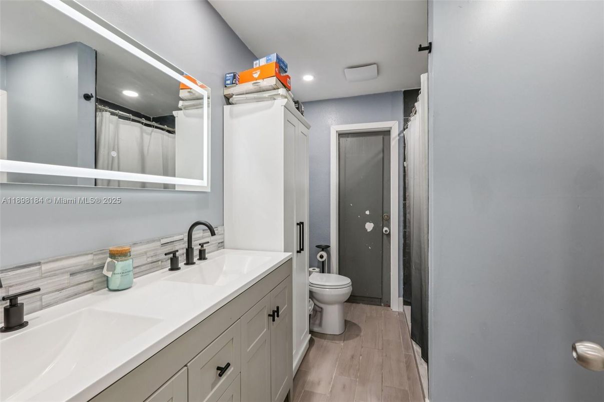 Bathroom, Dual Sink Vanities, Interior, Recessed Lighting, Wood Texture Flooring