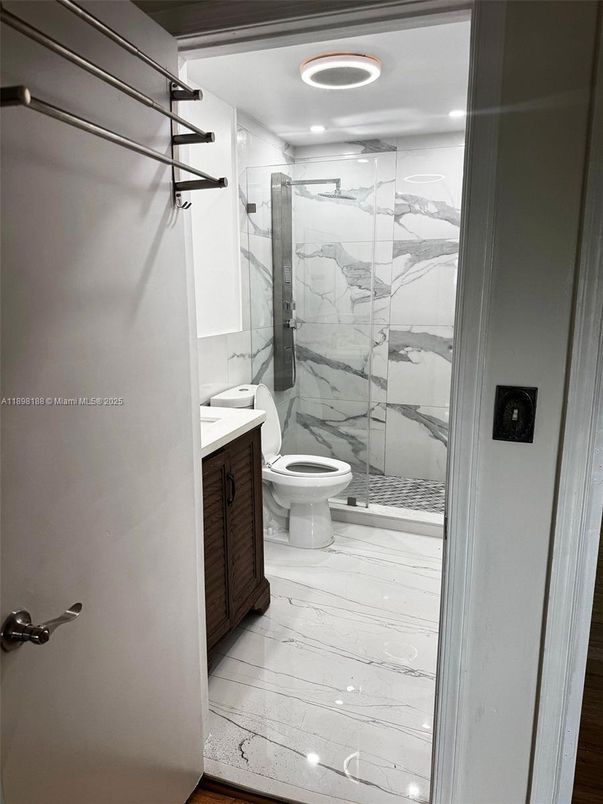 Bathroom, Glass Shower, Interior, Marble, Marble Walls, Recessed Lighting, Wood Texture Flooring