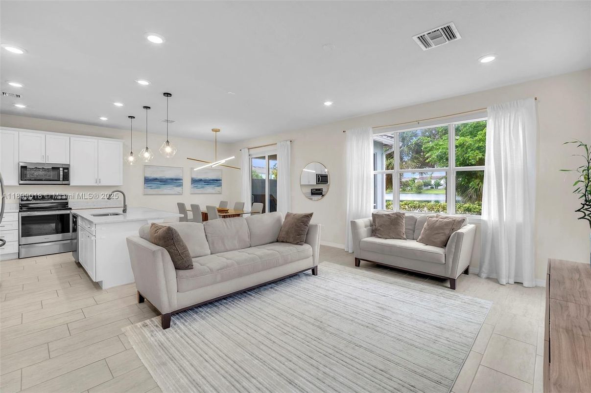 Dining room, Interior, Kitchen, Living room, Pendant Lights, Recessed Lighting, Stainless Steel Appliances, Wood Texture Flooring