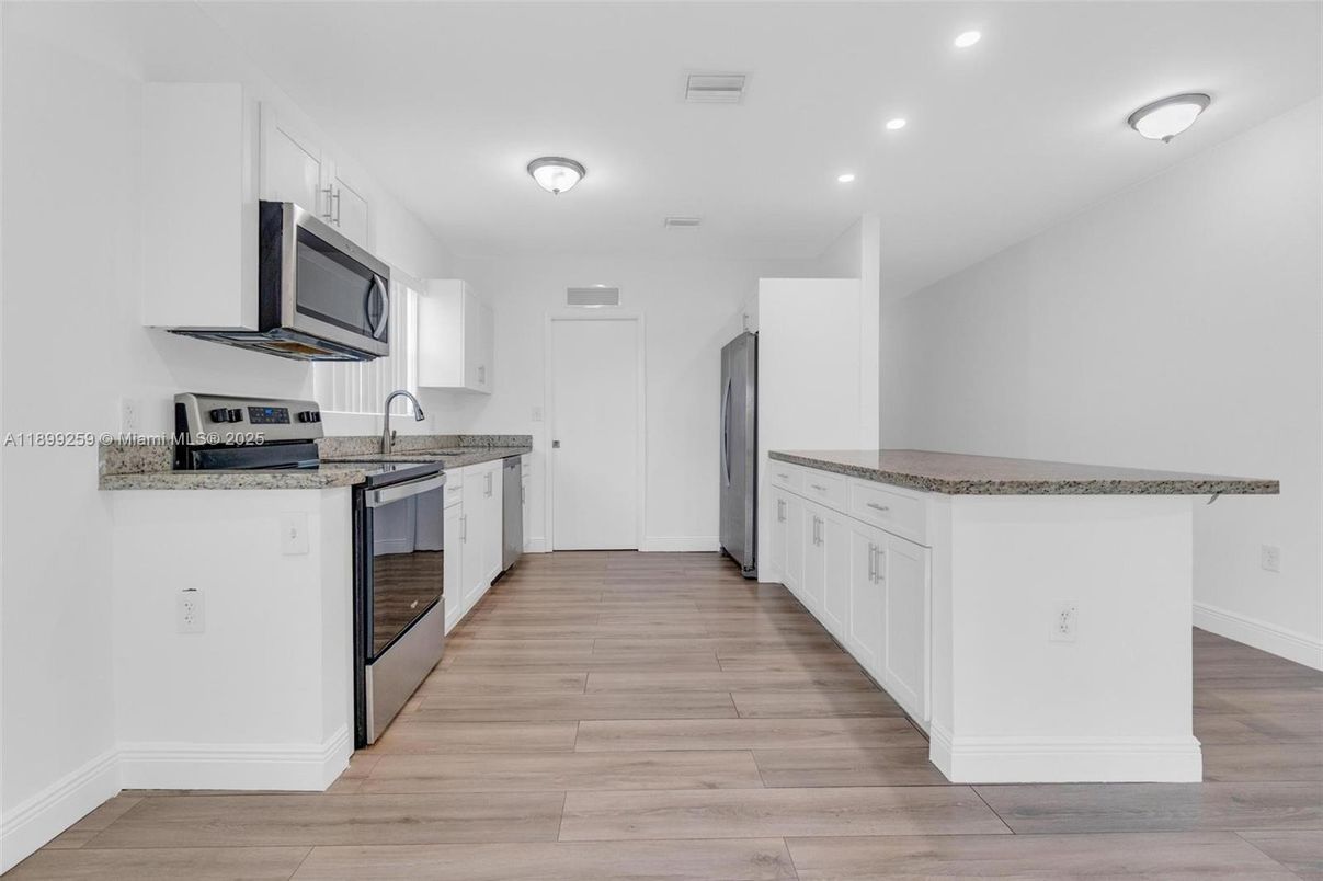 Interior, Kitchen, Recessed Lighting, Stainless Steel Appliances, Wood Texture Flooring