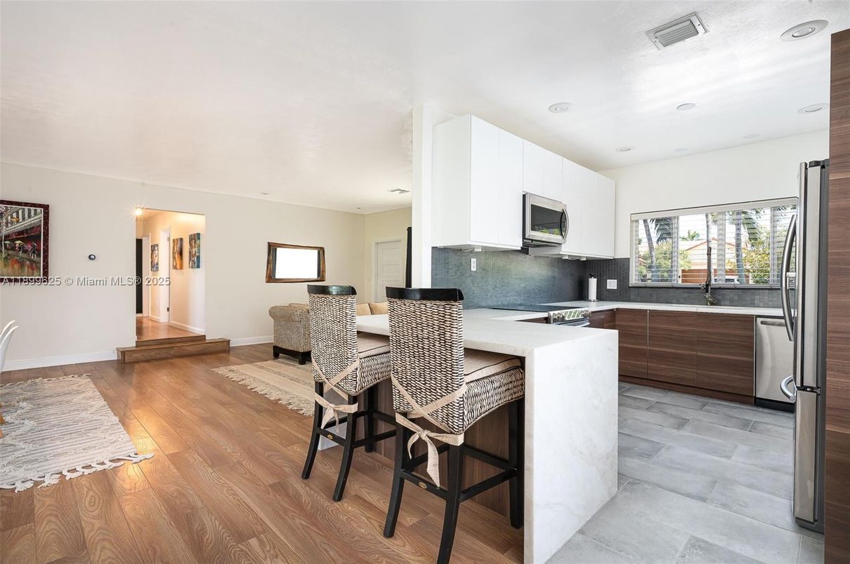 Dining room, Interior, Kitchen, Recessed Lighting, Stainless Steel Appliances, Wood Texture Flooring