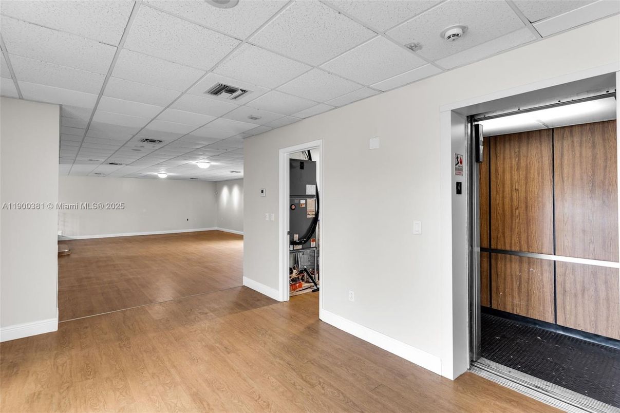 Elevator, Interior, Recessed Lighting, Wood Texture Flooring