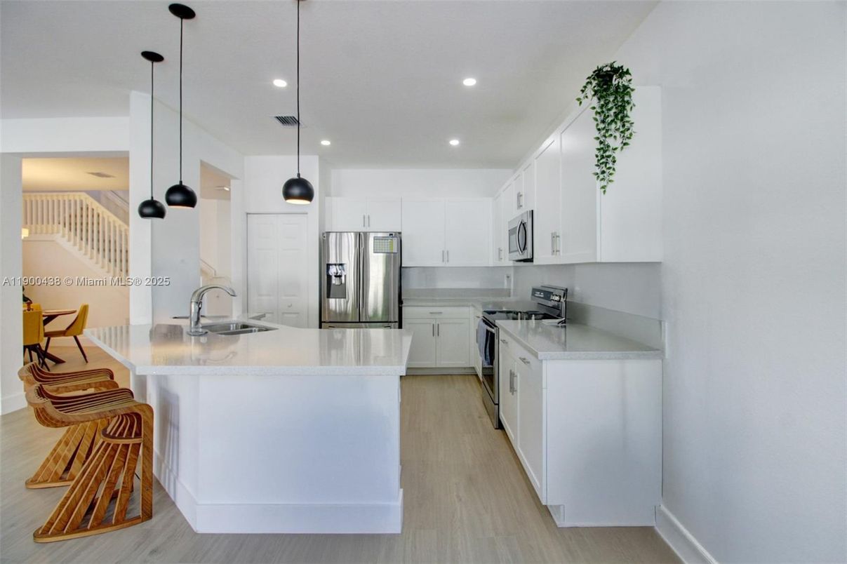 Interior, Kitchen, Pendant Lights, Recessed Lighting, Stainless Steel Appliances, Wood Texture Flooring
