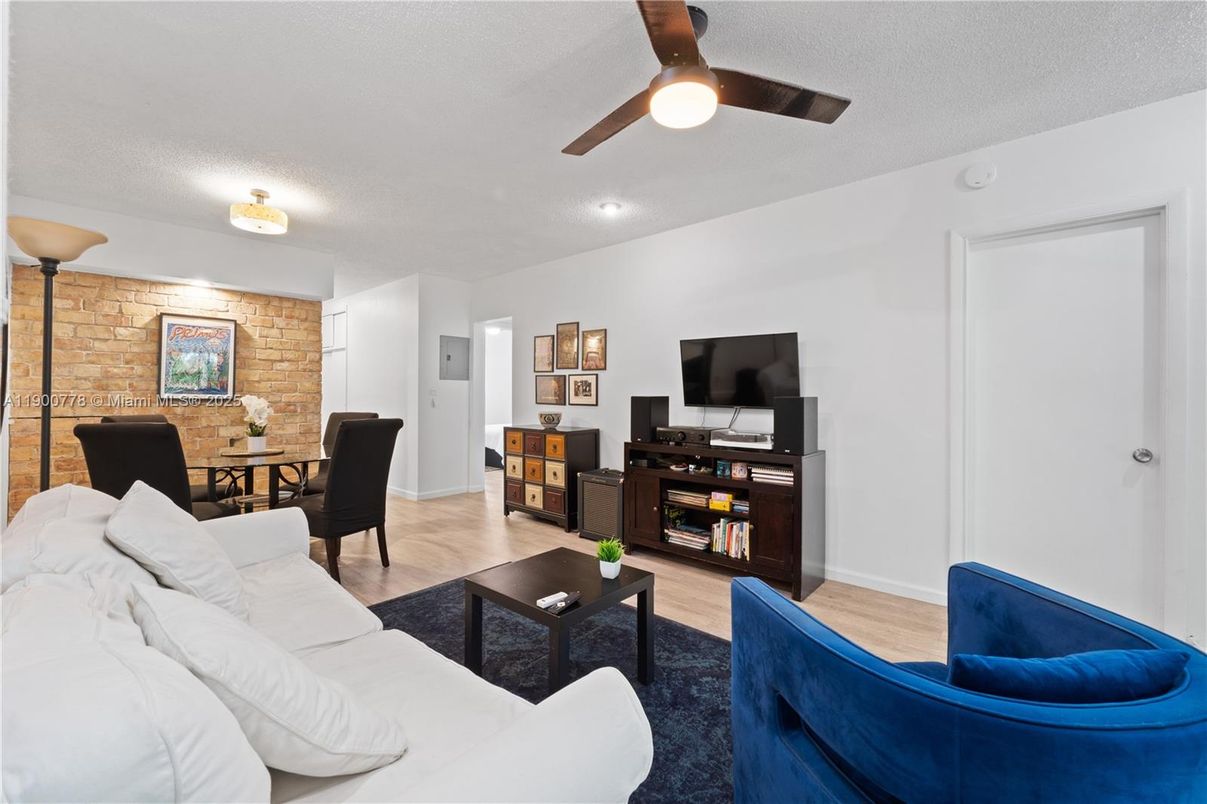 Dining room, Interior, Living room, Recessed Lighting, Stone Walls, Wood Texture Flooring
