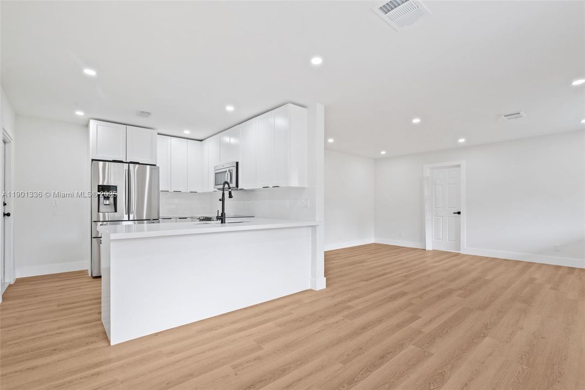 Interior, Kitchen, Recessed Lighting, Stainless Steel Appliances, Wood Texture Flooring