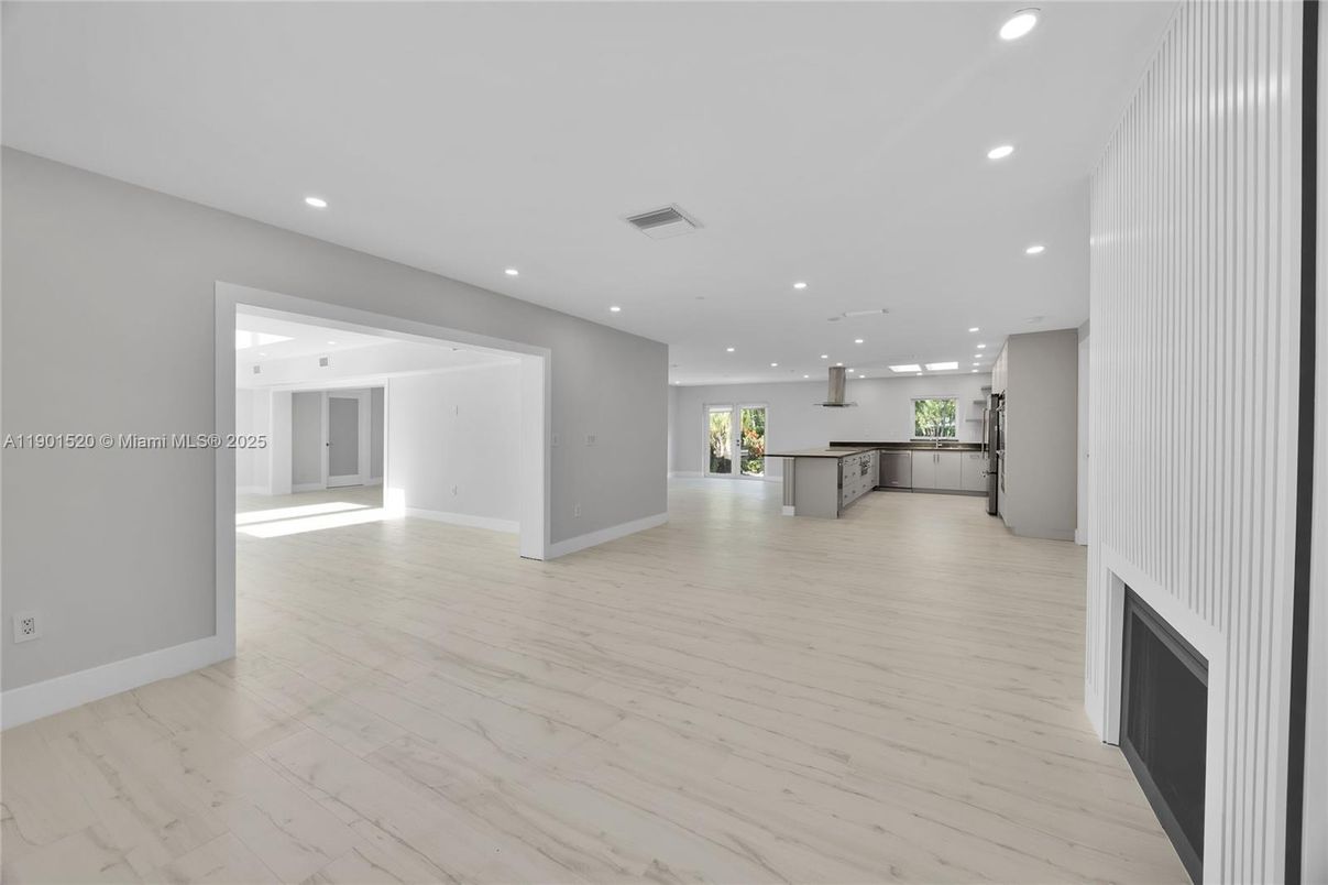Empty room, Fireplace, Interior, Kitchen, Pendant Lights, Recessed Lighting, Wood Texture Flooring