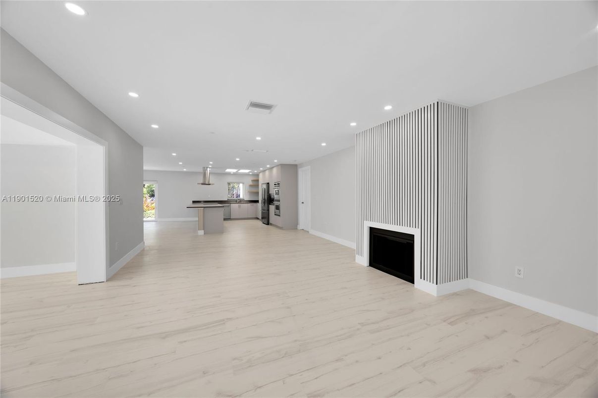 Empty room, Fireplace, Interior, Kitchen, Pendant Lights, Recessed Lighting, Stainless Steel Appliances