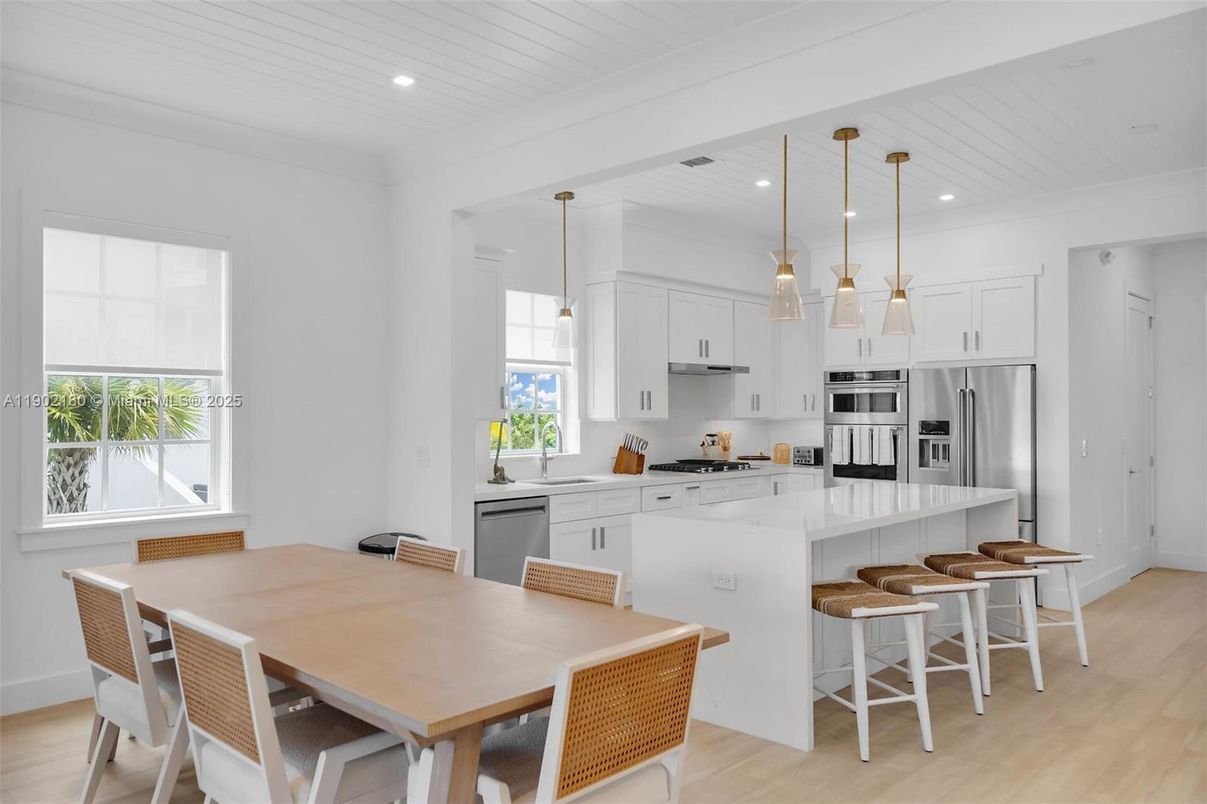 Dining room, Interior, Kitchen, Pendant Lights, Recessed Lighting, Stainless Steel Appliances, Wood Texture Flooring