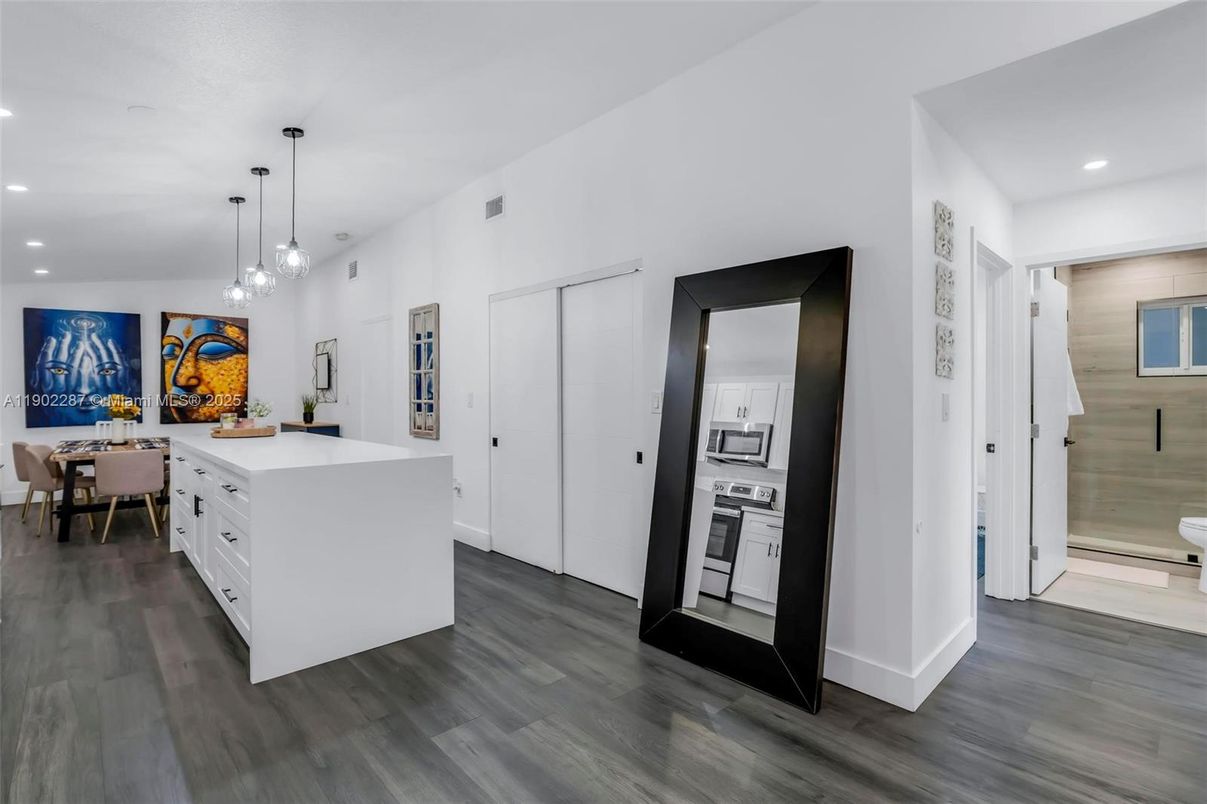 Dining room, Interior, Kitchen, Pendant Lights, Recessed Lighting, Stainless Steel Appliances, Wood Texture Flooring