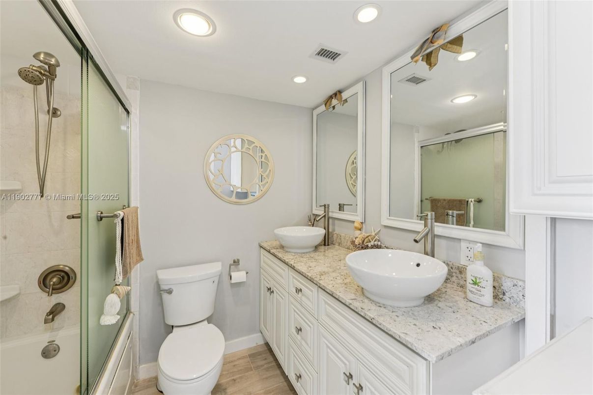 Bathroom, Dual Sink Vanities, Glass Shower, Interior, Recessed Lighting, Wood Texture Flooring