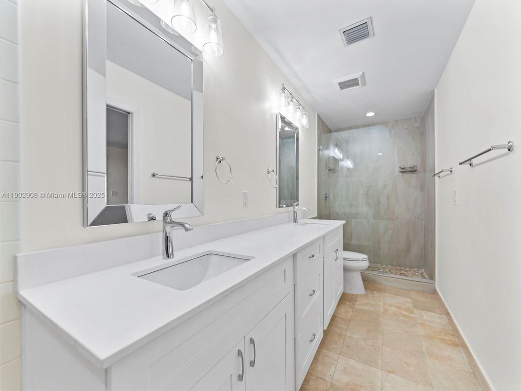 Bathroom, Dual Sink Vanities, Glass Shower, Interior, Marble Walls, Recessed Lighting