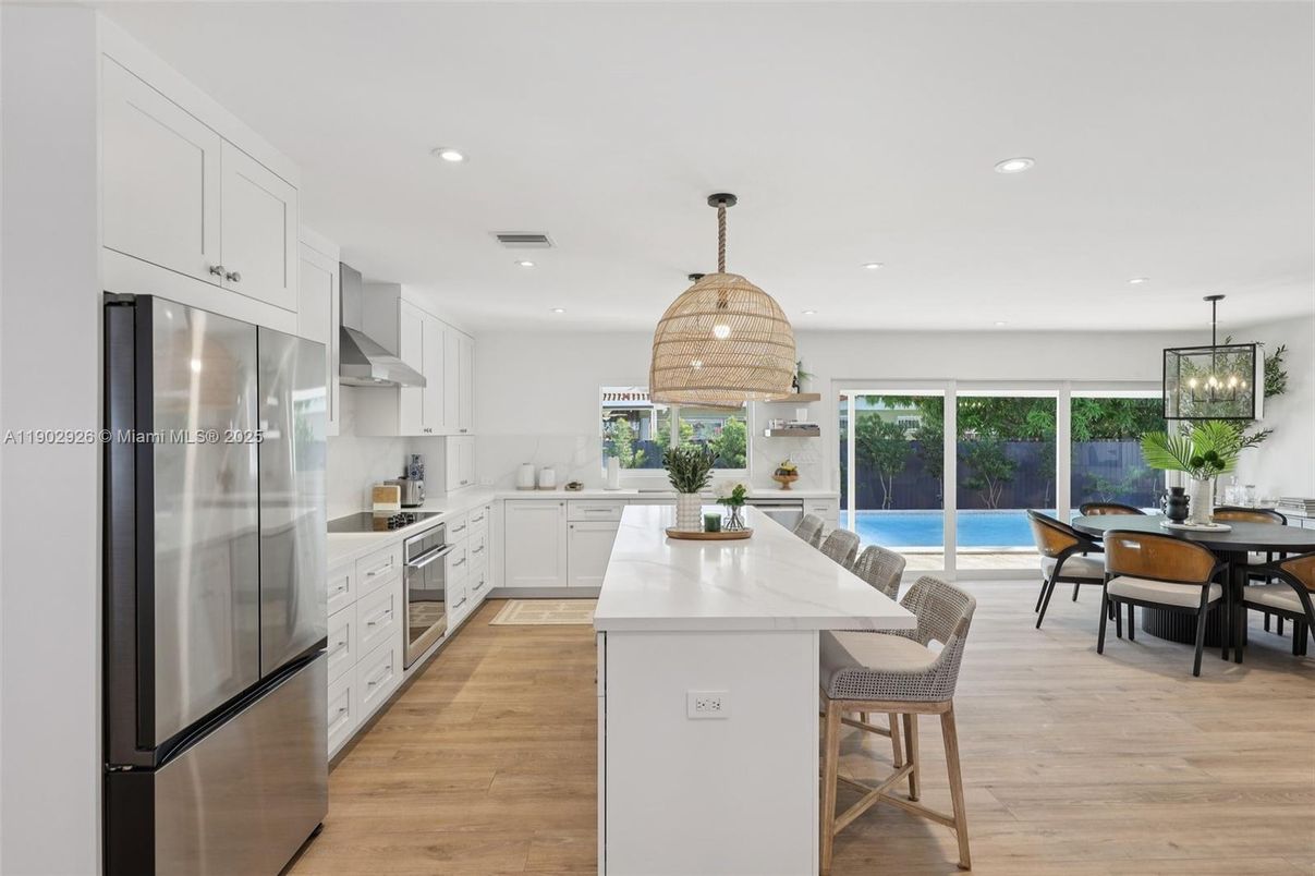 Dining room, Interior, Kitchen, Pendant Lights, Recessed Lighting, Stainless Steel Appliances, Wood Texture Flooring