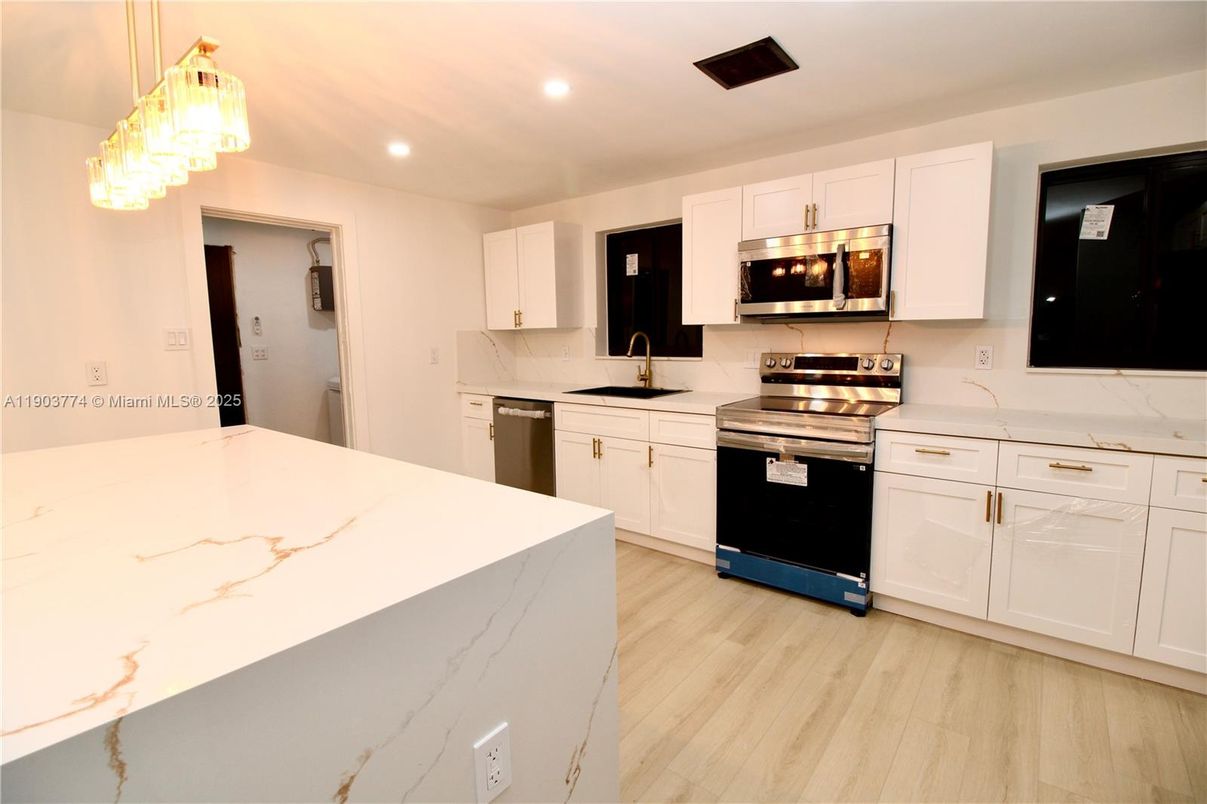 Interior, Kitchen, Recessed Lighting, Stainless Steel Appliances, Wood Texture Flooring