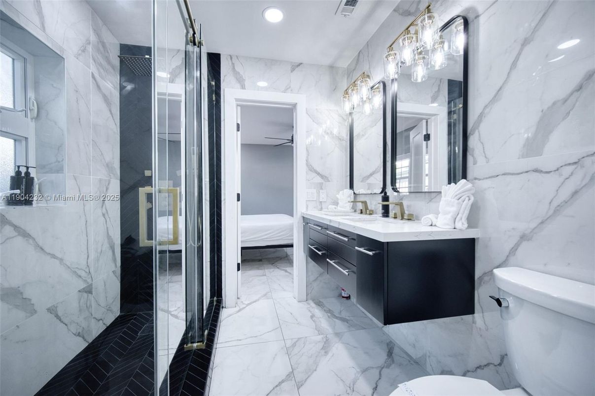 Bathroom, Bedroom, Dual Sink Vanities, Glass Shower, Interior, Marble, Marble Walls, Recessed Lighting
