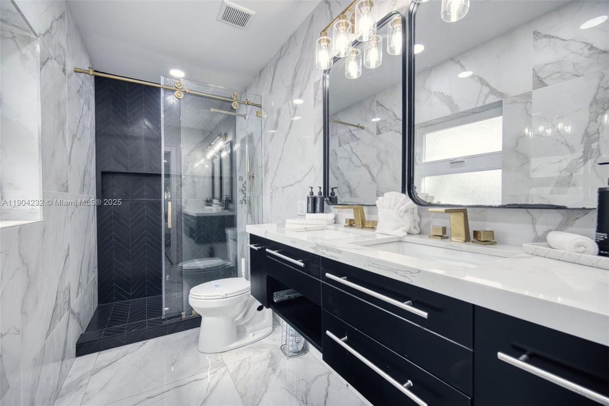 Bathroom, Dual Sink Vanities, Glass Shower, Interior, Marble, Marble Walls, Recessed Lighting