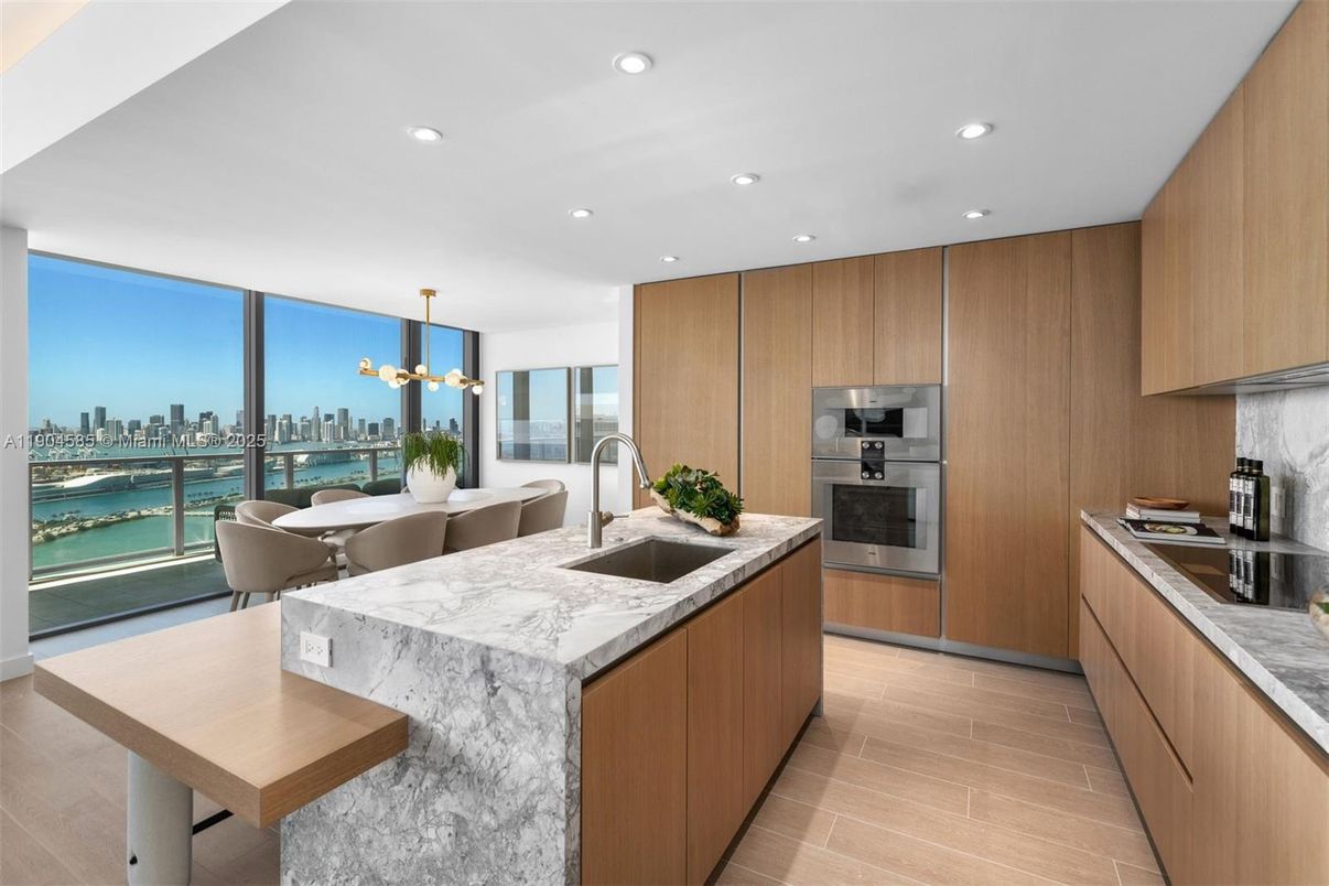 Dining room, Interior, Kitchen, Pendant Lights, Recessed Lighting, Stainless Steel Appliances, Water, Wood Texture Flooring