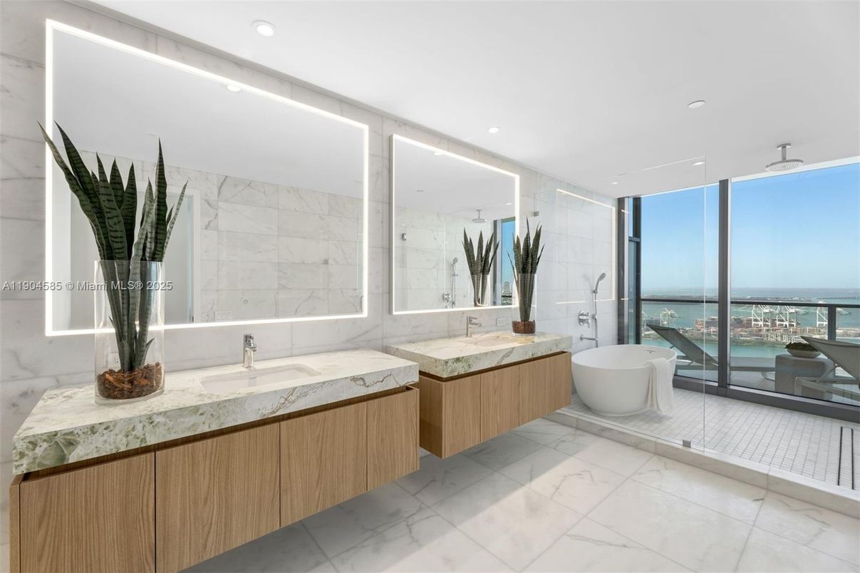 Bathroom, Dual Sink Vanities, Free Standing Baths, Glass Shower, Interior, Marble, Marble Walls, Recessed Lighting, Water