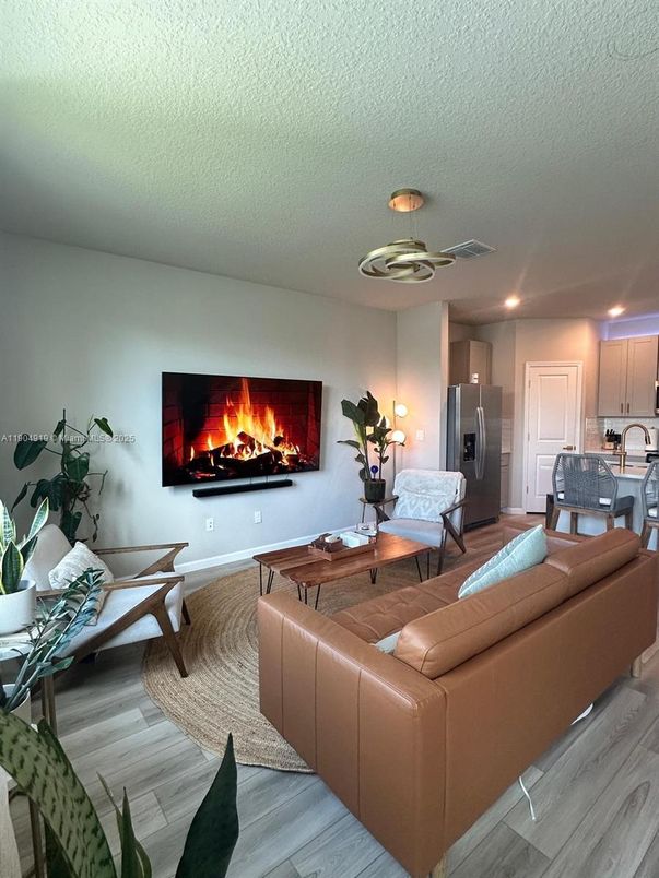 Fireplace, Interior, Kitchen, Living room, Recessed Lighting, Wood Texture Flooring