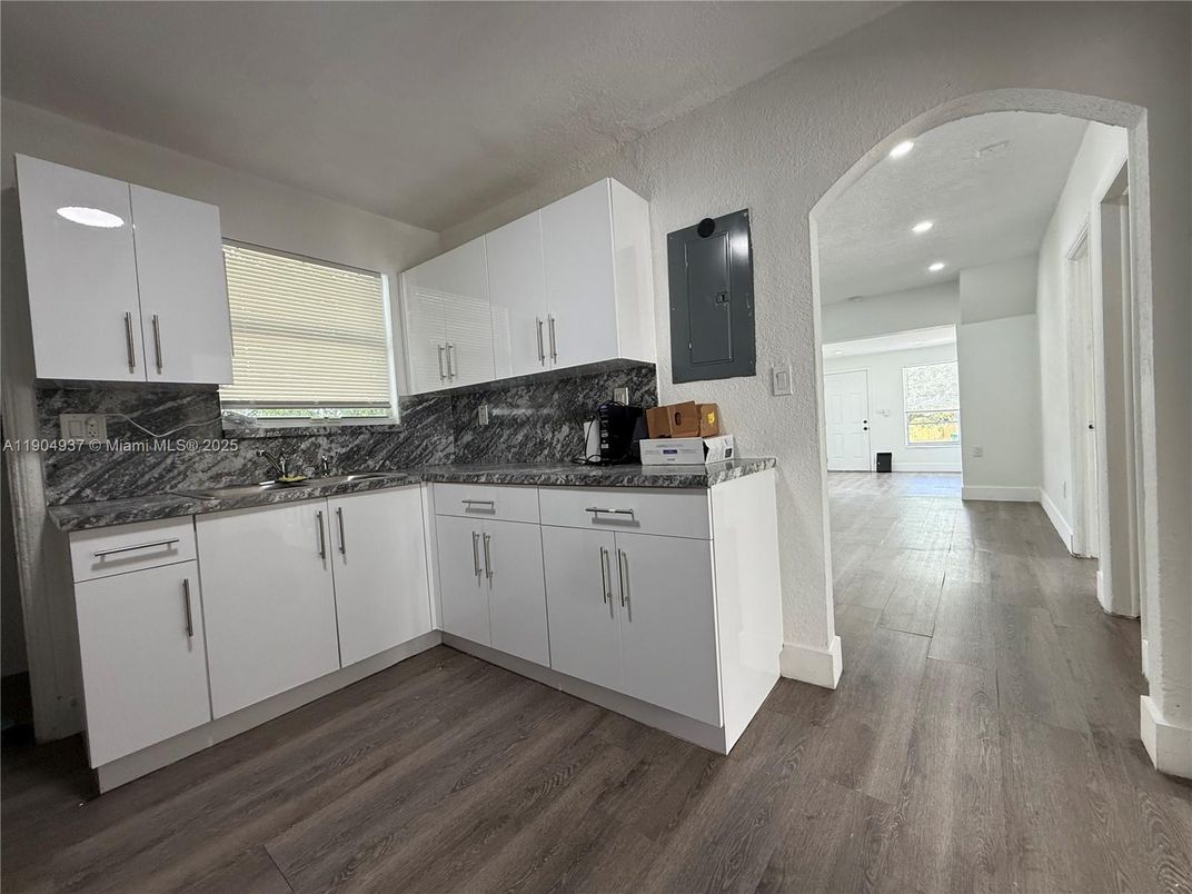 Interior, Kitchen, Marble Walls, Recessed Lighting, Wood Texture Flooring