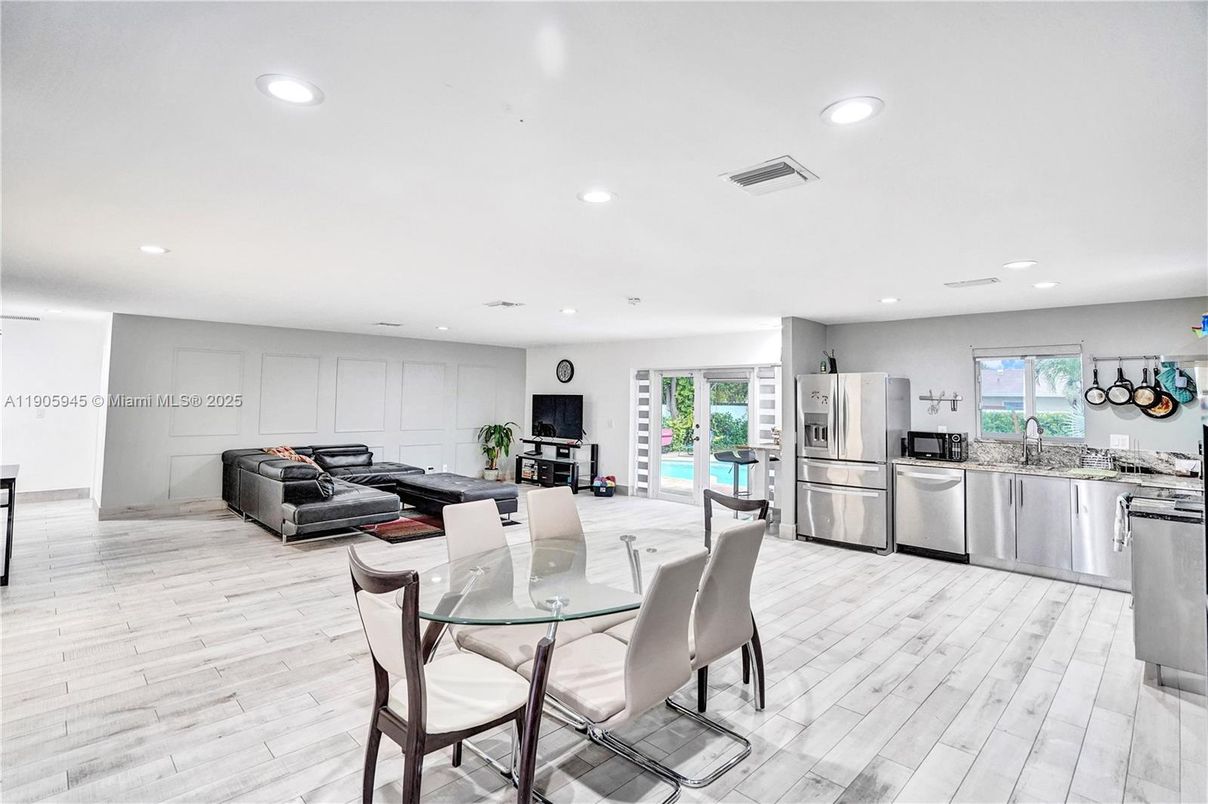 Dining room, Interior, Kitchen, Living room, Recessed Lighting, Stainless Steel Appliances, Wood Texture Flooring